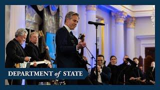 Secretary of State Blinken plays guitar at the launch of the Global Music Diplomacy Initiative