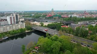 Fly along Havel river flowing through Spandau borough. Elevated view of transport infrastructure and