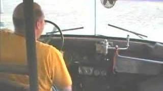 Driving the 1974 GMC  Ward school bus in the field
