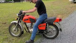 IZH Planeta 5 Soviet two-stroke motorcycle kick-starting.