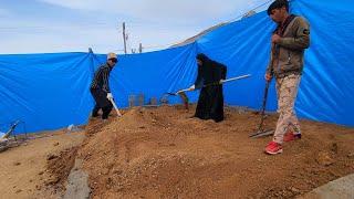 "The start of construction: filling the foundation with soil and walling Abu's house"