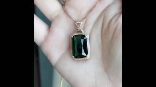 Elegance in Every Facet – Deep Green Tourmaline Set in 18K Gold, Framed with Sparkling Diamonds