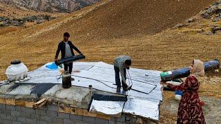 The story of a cloudy day; Ibrahim and Soghara's efforts to secure the roof of the house"