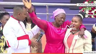 Emotional Moment as Bishop Ben Kiengei helps these women who tarmac to church