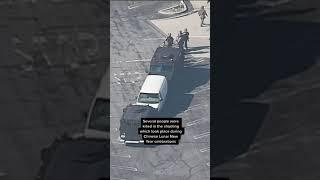 Police surround van linked to California shooting suspect