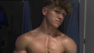 16 years old teen boy flexing muscles