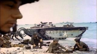 LVT and tank destroyer arrive on a beach Eniwetok Atoll, Marshall Islands during ...HD Stock Footage