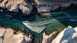 Nikolas Plytas Rides Milos' Turquoise Coast Among Lunar-Like Landscape