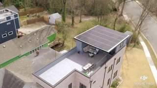 Ballasted system on a flat designer roof