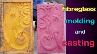 making a fibreglass mold on clay mural and casting