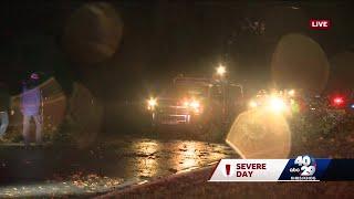 Storms topple power lines, flood roads