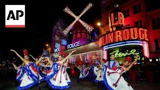 The Moulin Rouge cabaret in Paris has its windmill back, after a stunning collapse