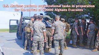 U.S. Marines perform organizational tasks in preparation for the arrival of 50000 Afghans Evacuees