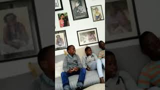 Bobi Wine, Barbie and their Children read the story of Fidel Castro.