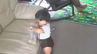 Alex Prin Braun walks around with his snacks (13 months old baby)