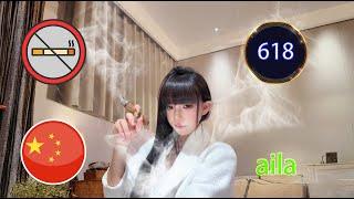 A Chinese elegant girl smoking a cigar, Aila. 618