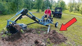 I bought a cheap Harbor Freight towable backhoe to dig out stumps