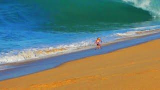 Raw Footage - Surfers Try to Ride Massive Beach Waves on Tiny Surfboards in Mexico