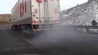 Semi truck smoking brakes down hill