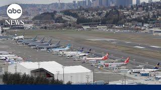 Unruly plane passenger tried to open emergency door, officials say