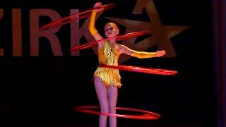 Circus acrobatic performance with hoops at the Talent Show ZIRKA! Dance with hoops