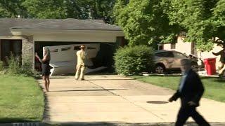 Car crashes into 2 homes in Southfield, destroys garage door