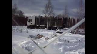 2 logging trucks on narrow road