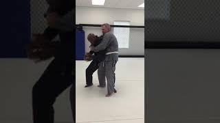 Brazilian Jiu-Jitsu self-defense against bear hug from behind