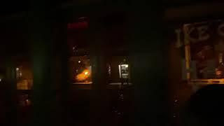 Ike Clanton’s Haunted Hotel Storefront at Night Peering in Windows