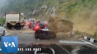 Giant Rock Hits Vehicles on Road in India | VOA News