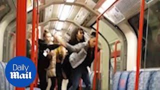 Woman smashes BOTTLE during a brawl on the tube