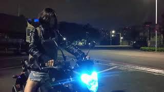 Cute chick revving her bike