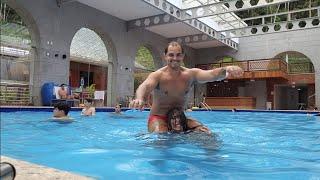 Strong Girl lifts a Heavy Man in the Pool