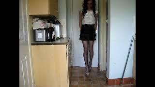 Tgirl Jenna in black mini skirt & white top