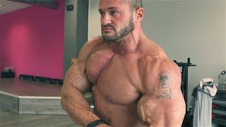 BEAST MODE - Massive bodybuilder Alexej Kauz posing in the gym