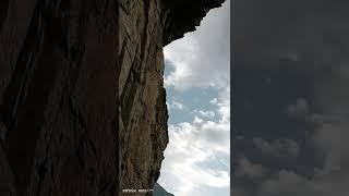 kargaah Budda its an archeological site located in G.B is a curved image of a large.standaing Buddah