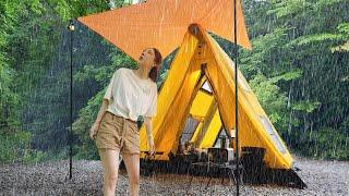 Solo camping in a mess in a leaky inflatable tent in heavy rain