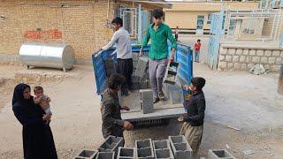 "Brother Ibrahim: Bringing blocks to Suzan's house, by Reza"