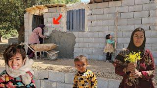 Khadija's attempt to cement the walls of the hut to give it a new look