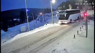 Freight train narrowly misses bus at railway crossing in Yantal, Russia