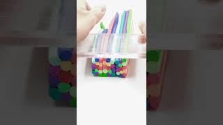 Artist is creating a vibrant colorful cane with polymer clay!
