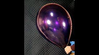 Inflating a crystal purple Qualatex 24 inch latex balloon