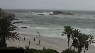 Lifeguards keep warm and active by playing cricket on a deserted Clifton beach. From livestream