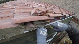 Cementing the verges to complete a tiled roof. The old boy method...