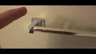 HOW TO PUT A TOWEL RACK BACK ON THE WALL