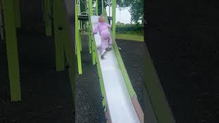 Little girl's joyful descent down the tallest slide in the park || WooGlobe