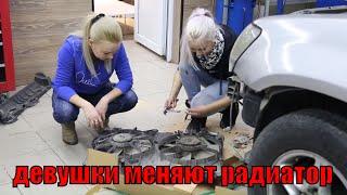 beautiful girls repairing a car