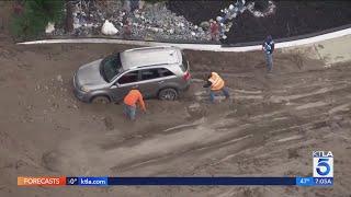 Mud, flooding swamp Southern California wildfire zones after powerful storms 