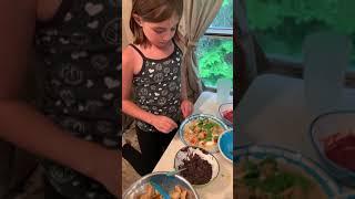 Talia Goldstein making her type of soft Shell taco