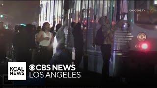 Chaos erupts overnight in downtown LA as mob vandalizes businesses, trains and a police car